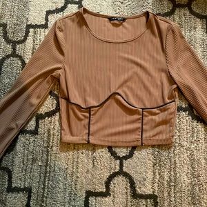 Brown crop top the cuts a breast